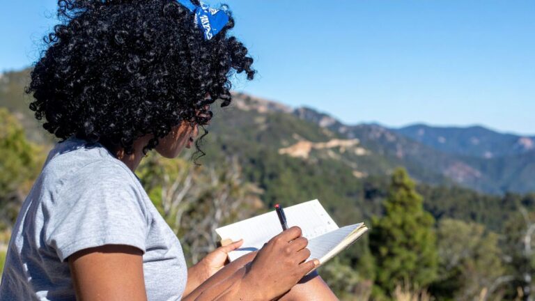 Women benefiting from AI journaling outside on a beautiful day